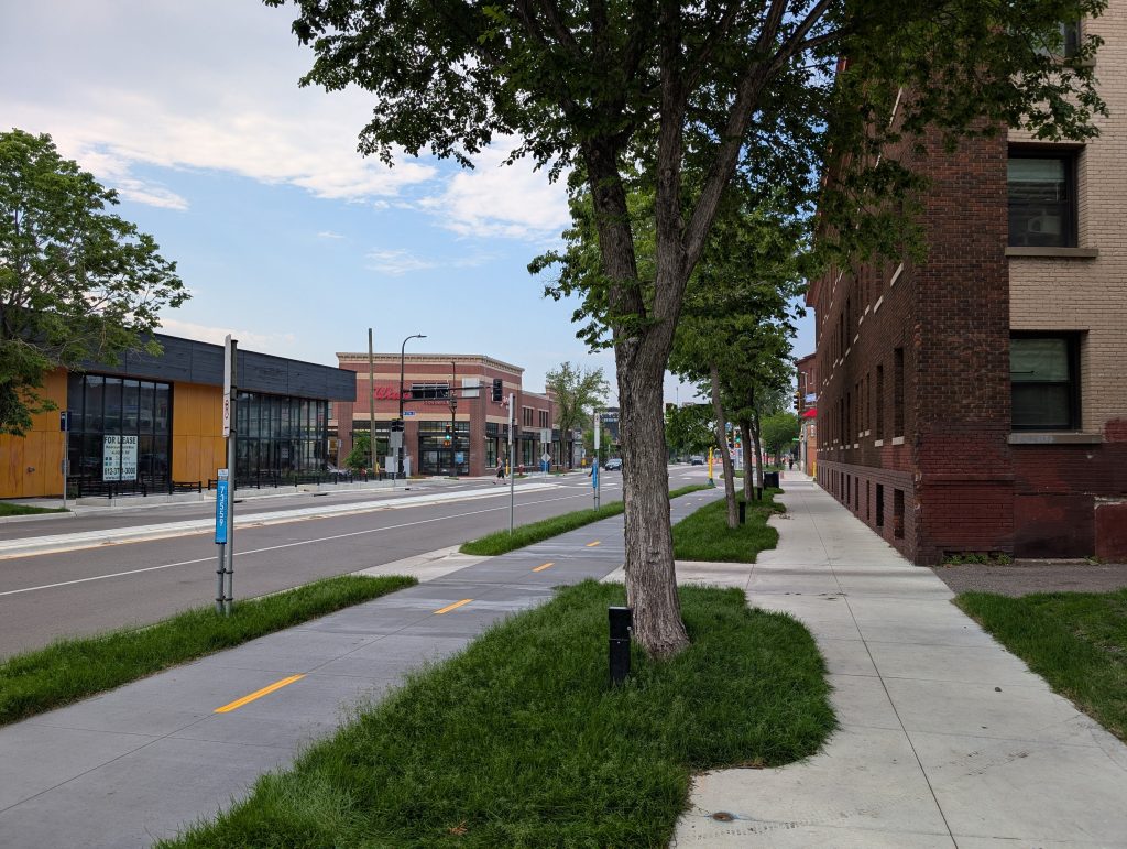 Trees and greenery separation of bike facility and sidewalk